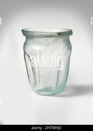 Art inspired by Glass cup, Mid Imperial, 2nd–3rd century A.D., Roman, Glass; blown and tooled, H.: 2 3/4 in. (7 cm), Glass, Translucent blue green. Slightly flaring, uneven, collar-like rim with vertical, rounded lip; short, concave neck; bulbous shoulder; body tapering downwards, Classic works modernized by Artotop with a splash of modernity. Shapes, color and value, eye-catching visual impact on art. Emotions through freedom of artworks in a contemporary way. A timeless message pursuing a wildly creative new direction. Artists turning to the digital medium and creating the Artotop NFT Stock Photo