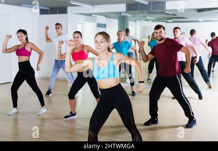 adults of different ages dancing at dance class Stock Photo