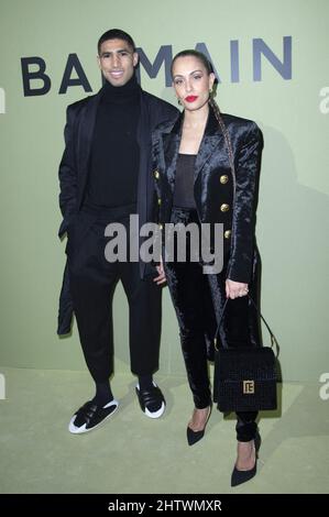 Achraf Hakimi And Hiba Abouk Attending The Balmain Womenswear Fall ...