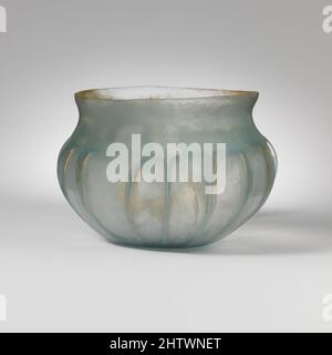 Art inspired by Glass ribbed bowl, Early Imperial, mid-1st century A.D., Roman, Glass; blown and tooled, H.: 3 in. (7.6 cm), Glass, Translucent light blue green., Knocked-off, uneven, ground rim; concave neck; globular body curving in to thick, flat bottom., Side tooled into fifteen, Classic works modernized by Artotop with a splash of modernity. Shapes, color and value, eye-catching visual impact on art. Emotions through freedom of artworks in a contemporary way. A timeless message pursuing a wildly creative new direction. Artists turning to the digital medium and creating the Artotop NFT Stock Photo