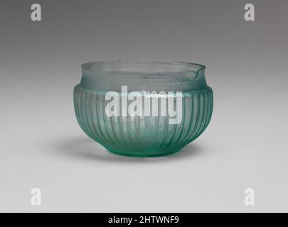 Art inspired by Glass ribbed bowl, Early Imperial, 1st century AD, Roman, Glass; mold-blown, H.: 1 7/8 in. (4.8 cm), Glass, Translucent blue green., Vertical unworked rim; pronounced concave shoulder expanding downwards; convex sides sloping inwards towards projecting rounded base ring, Classic works modernized by Artotop with a splash of modernity. Shapes, color and value, eye-catching visual impact on art. Emotions through freedom of artworks in a contemporary way. A timeless message pursuing a wildly creative new direction. Artists turning to the digital medium and creating the Artotop NFT Stock Photo