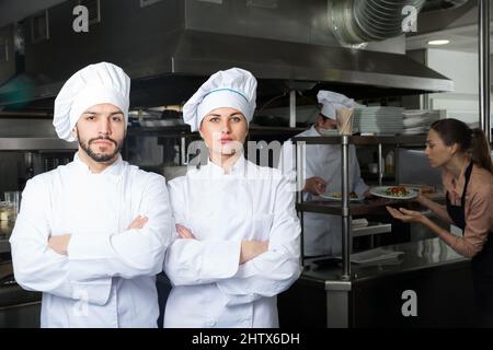 Two chefs in professional kitchen Stock Photo