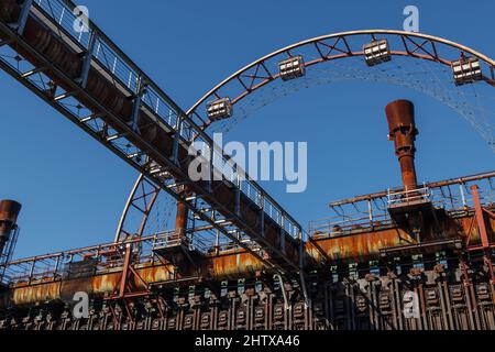 Old rusty machine with complex vault, pipeline and utilities in former coal mine industrial building at Zeche Zollverein in Essen, Germany. Stock Photo