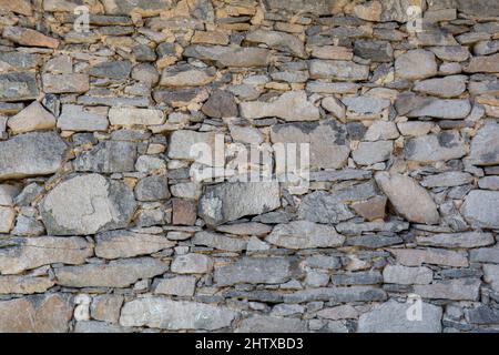 Old antique stone wall texture. Rocky Structure Backdrop. Background. Stock Photo
