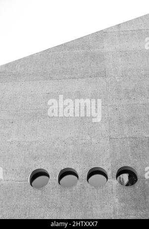 Black and white, concrete facade with round windows, Swiss National Museum, Zurich Auditorium, modern architecture, Zurich, Switzerland Stock Photo