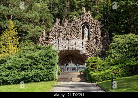 Marien Grotto pilgrimage site in the forest, replica of the Lourdes grotto with statue of the Virgin Mary, Bad Salzschlirf, Vogelsberg and Roehn Stock Photo