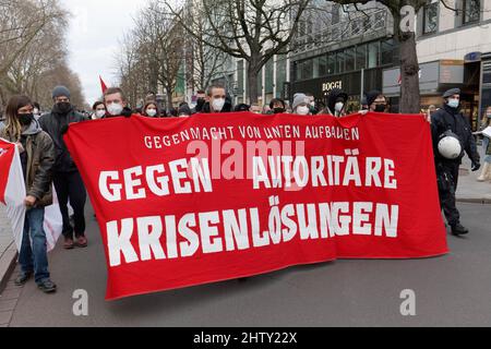 Demonstrators of the Left Party carry banner Against authoritarian crisis solutions, demonstration against compulsory vaccination and Corona measures Stock Photo