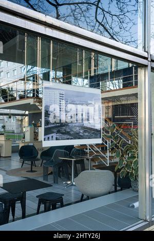 View through the window pane into the empty Cafe Babette in Karl-Marx-Allee, Berlin, Germany Stock Photo