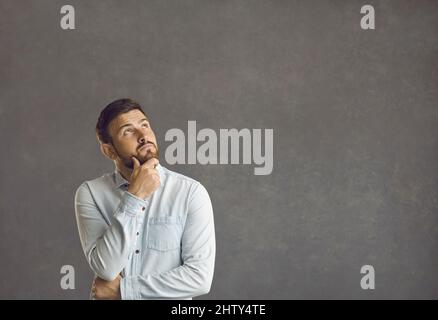 Portrait of a pensive casual man looking to the side Stock Photo