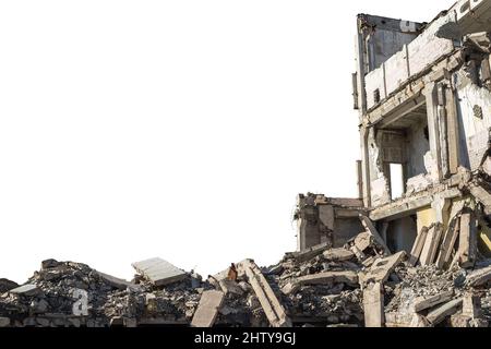 A large ruined building with a pile of construction debris and concrete debris isolated on a white background. The cut object. Stock Photo