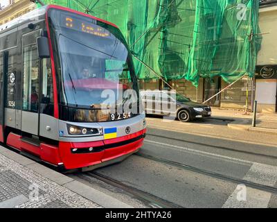 Prague, Czech Republic - March 2 2022: Ukrainian flag on a Prague tram as a sign of solidarity with Ukraine and a protest against Russian aggression. Stock Photo