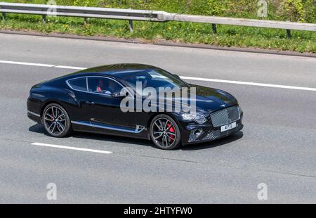 2019 black Bentley Continental GT 5950cc 8 speed automatic petrol 2dr coupe, driving on the M61 motorway UK Stock Photo