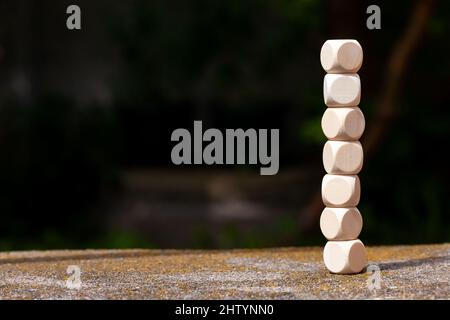 7 empty blank wooden cubes, dice stacked on top of each other, copy space corporate business presentation slide background, text space, nobody. Integr Stock Photo