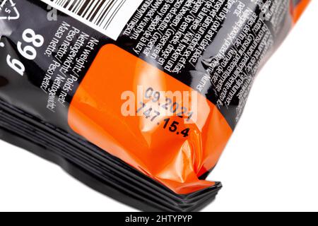 Old packed food past expiration date, date printed on plastic food packaging, detail, extreme closeup. Food expiring, going bad simple concept, nobody Stock Photo