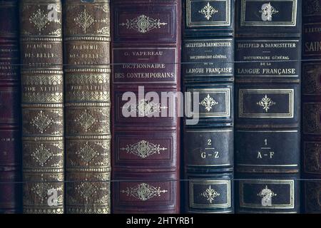Old books bound in leather covered embossed with gold foil Stock Photo