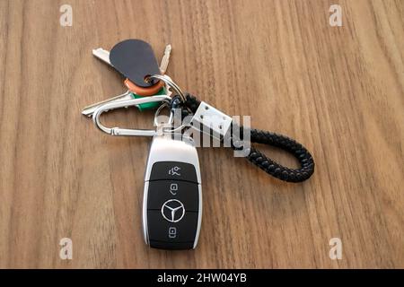 Keys, key loop with Mercedes Benz car key with various house keys and fob Stock Photo