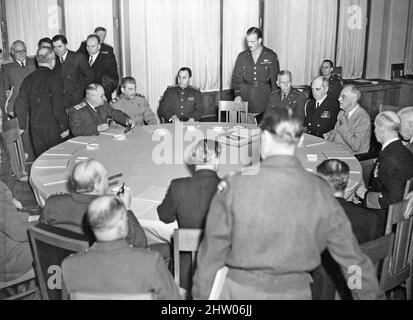 YALTA CONFERENCE 4-11 February 1945. On the first day seated top left are Stalin with Molotov to his left and a translator to his right. Roosevelt at right in light suit is flanked by Admiral William Leahy and General George C. Marshall, Churchill is seated at left with back to camera. Stock Photo