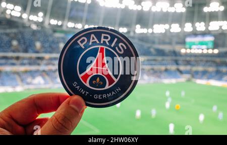 August 30, 2021, Paris, France. The emblem of the football club Paris Saint-Germain F.C. against the backdrop of a modern stadium. Stock Photo