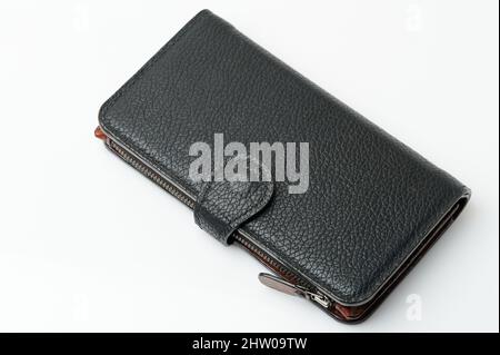 Handmade black leather purse side view isolated on studio background Stock Photo