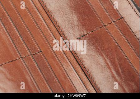 Brown Saffiano Leather Stitched With A Seam. Real Or Genuine Leather Texture  Background. Stock Photo, Picture And Royalty Free Image. Image 162741821.