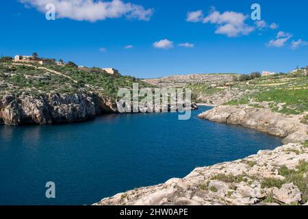 The bay and low cliffs of the drowned ria valley of Mgarr ix-Xini, in the island of Gozo, Malta Stock Photo