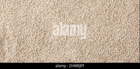 Dried white quinoa seeds background Stock Photo