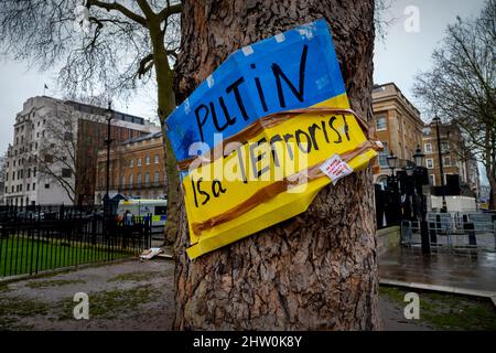 London, UK. 3rd Mar, 2022. Putin is a Terrorist sign in Whitehall London UK in reaction to invasion of, Ukraine. 3rd Mar, 2022. A sign calling the Russin President Vladimir Putin a Terrorist stuck on a tree in Whitehall, the centre of the British Government and opposite Downing Street, the home of the British Prime Minister, in London England UK. Credit: BRIAN HARRIS/Alamy Live News