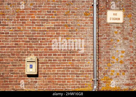 Official french mail boxes on a brick wall Stock Photo