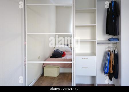 Wardrobe with mirrored doors in the bedroom Stock Photo