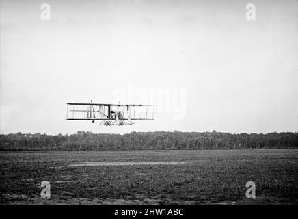 An early 20th century photograph of a Wright Biplane Type B flown by Lt Harry Graham at College Park Aviation Field in Maryland, United States of America. The Wright Machine invented and developed by the Wright brothers, Orville and Wilbur, American aviation pioneers who are generally credited with inventing aircraft controls that made fixed-wing powered flight possible enabling the first controlled, sustained flight of a powered, heavier-than-air aircraft with the Wright Flyer on December 17, 1903. Stock Photo