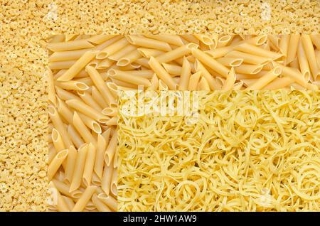 Textured background of various raw durum wheat pasta, top view Stock Photo