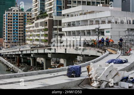 Manila. 3rd Mar, 2022. Workers are seen on the construction site of the China-funded Binondo-Intramuros Bridge in Manila, the Philippines on March 3, 2022. The Binondo-Intramuros Bridge is a steel bowstring arch bridge in Manila City that will connect the Intramuros side and Binondo side over the Pasig River. Credit: Rouelle Umali/Xinhua/Alamy Live News Stock Photo