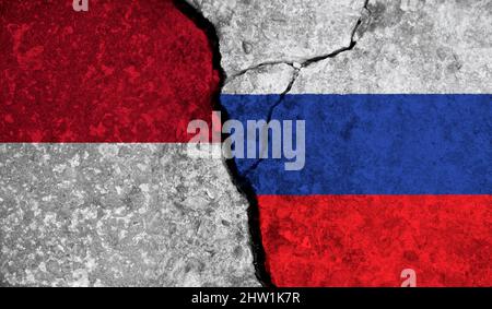 Political relationship between Indonesia and russia. National flags on cracked concrete background Stock Photo