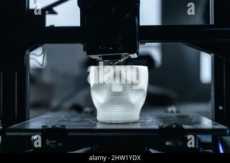 The 3D printer prints white plastic model Stock Photo