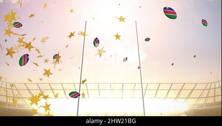 Image of stars over rugby balls coloured with namibia flag falling at stadium Stock Photo