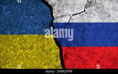 Political relationship between Ukraine and russia. National flags on cracked concrete background Stock Photo