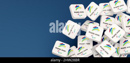 Guilherand-Granges, France - March 03, 2022. Cubes with logo of 2022 Paralympic Games in Beijing in China. International winter multi-sport event. Stock Photo