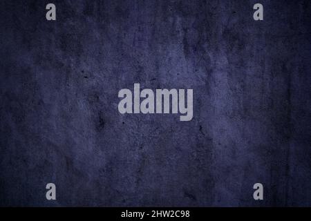 Grunge textured dark purple concrete wall surface for background Stock Photo