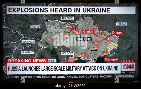 A TV screenshot of a CNN news graphic showing the Russian military attack on Ukraine. Stock Photo
