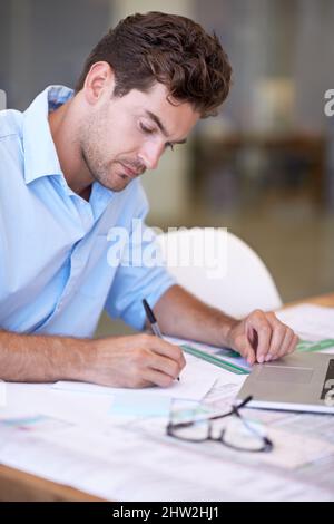 Vision and design. An attractive male architect focused on his work. Stock Photo