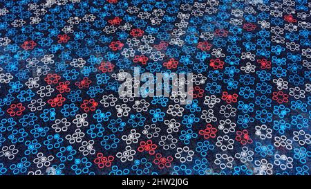 Background for focusing on small moving dots. Animation. Electronic background with multicolored dots moving along primitive floral pattern. Dots form Stock Photo