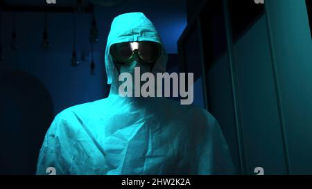 Close-up of mannequin in protective suit. Stock footage. Creepy eyes of mannequin are visible in protective glasses and mask. Equipment from virus or Stock Photo