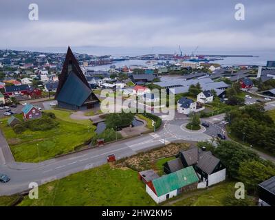 Beautiful aerial view of the city of Torshavn in the Faroe Islands and its classic colorful houses, red Government building with grass on the roof, and Stock Photo