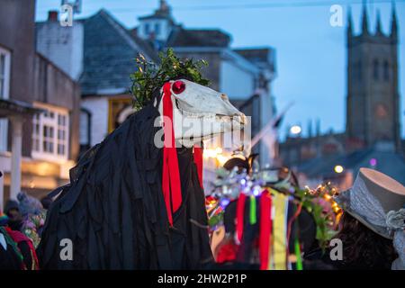 Music and dancing in the streets during the Montol mid-winter festival. Penzance, Cornwall. People wear 'Guise' costumes like the Venice Biennale Stock Photo