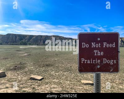 Sign posted in a Roosevelt National Park stating not to feed the prairie dogs.  Stock Photo