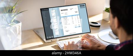 Accountant Using Online E Invoice Software On Tablet Stock Photo