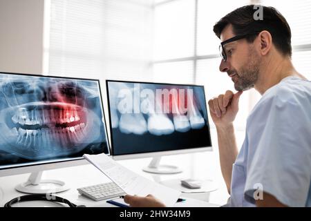 Radiologist Dentist Using X Ray Software On Desktop Computer Stock Photo
