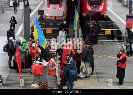 Munich, Germany. 03rd Mar, 2022. Caritas employees stand at Munich's main train station to receive women and men from Ukraine. Credit: Felix Hörhager/dpa/Alamy Live News Stock Photo