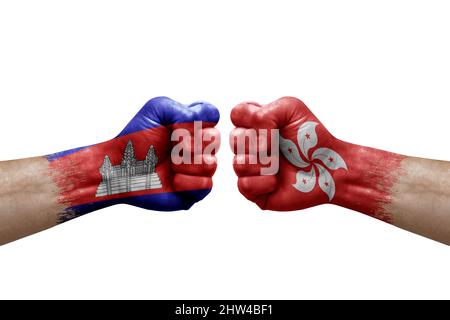 Two hands punch to each others on white background. Country flags painted fists, conflict crisis concept between cambodia and hong kong Stock Photo