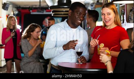Couple are drinking cocktails and having fun in the nightclub Stock Photo